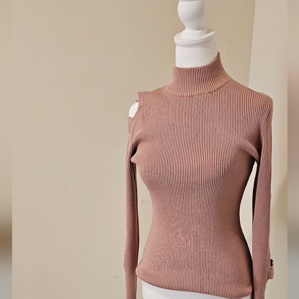 Women's pink long sleeve turtle neck sweater. Size(m)